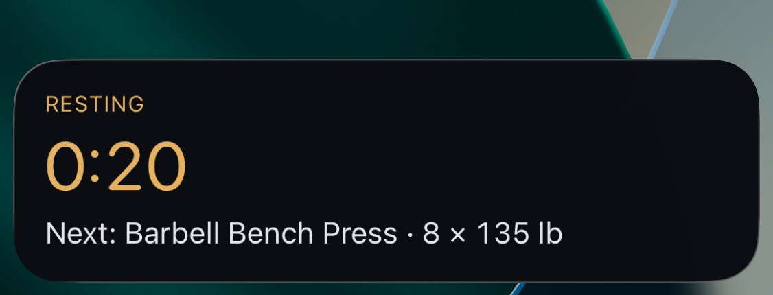 Spotter on the iPhone lock screen: Resting, 0:20 remaining, next Barbell Bench Press, 8 reps at 135 lb.